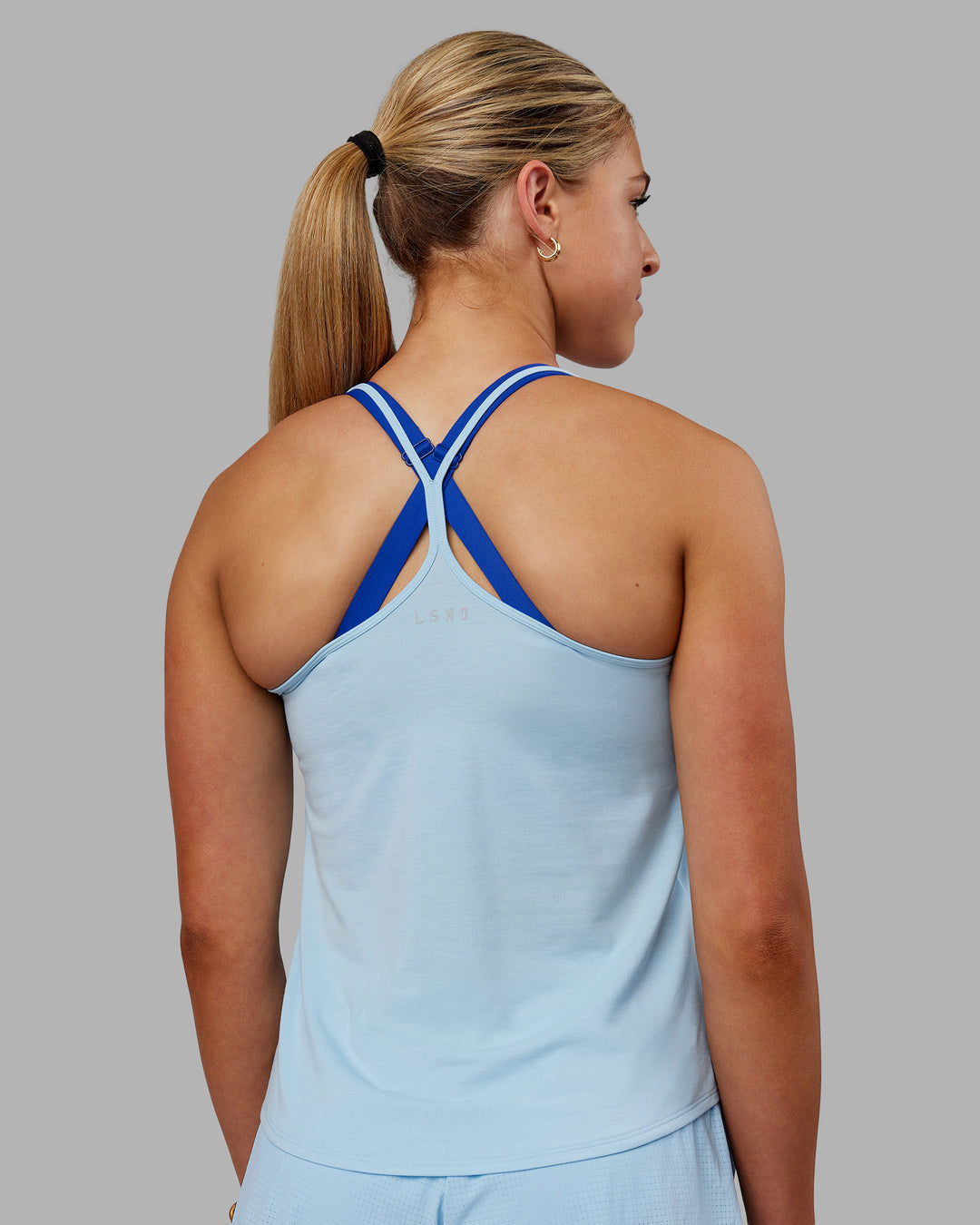Woman wearing Swift Active Tank - Glacial Blue