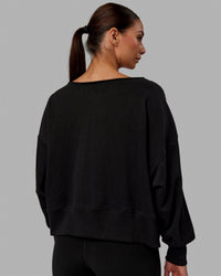 Woman wearing Tempo Sweater - Black