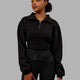 Woman wearing Thrive Corset 1/4 Zip Sweater - Black
