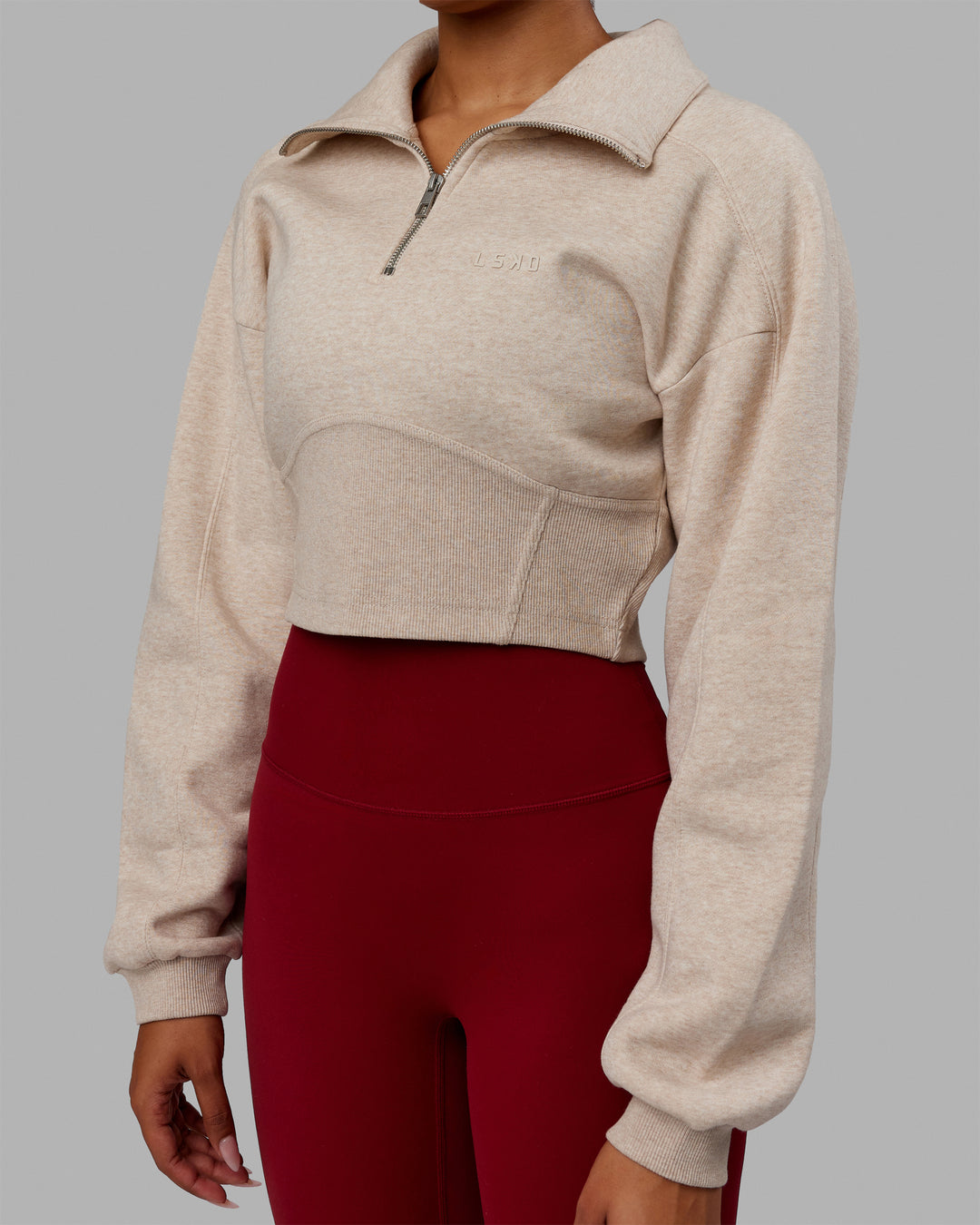 Woman wearing Thrive Corset 1/4 Zip Sweater - Oatmeal Marl