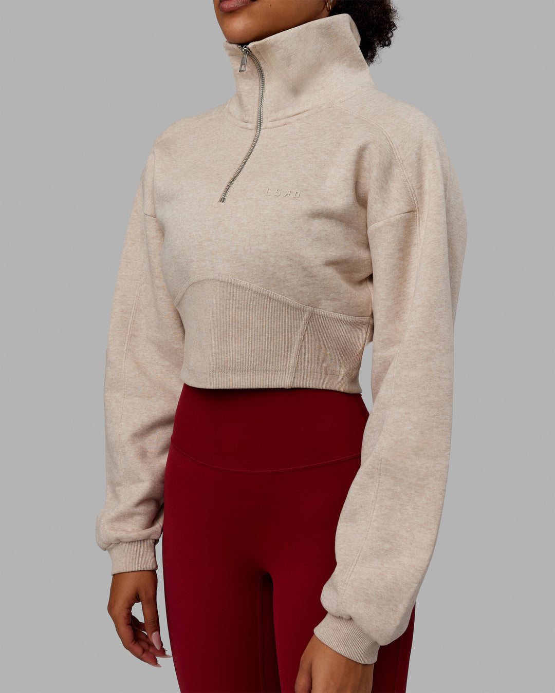 Woman wearing Thrive Corset 1/4 Zip Sweater - Oatmeal Marl