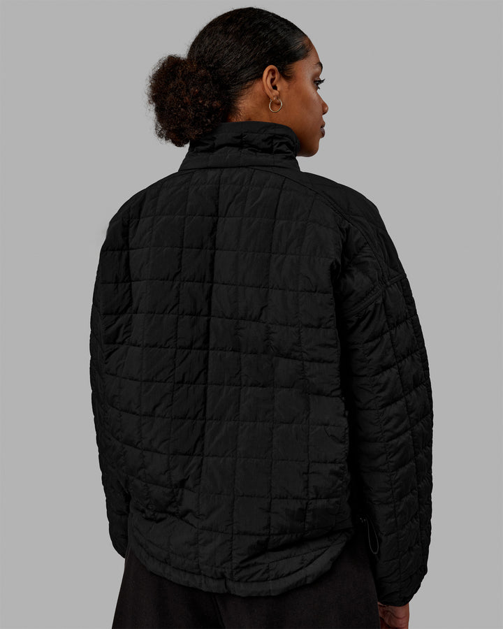 Woman wearing Thrive Packable Jacket - Black