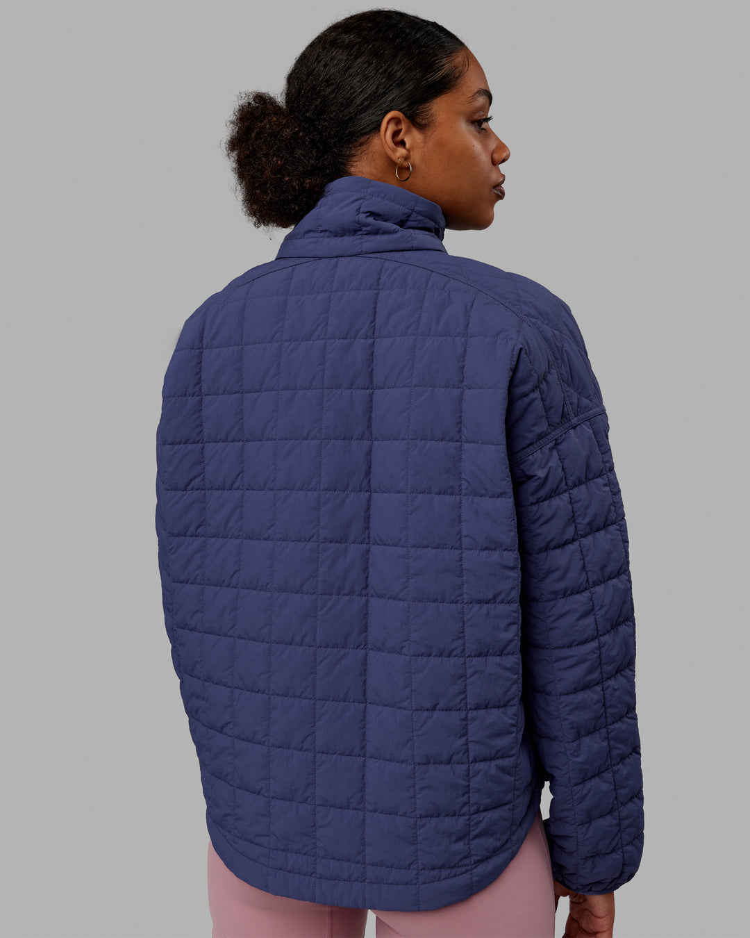 Woman wearing Thrive Packable Jacket - Future Dusk
