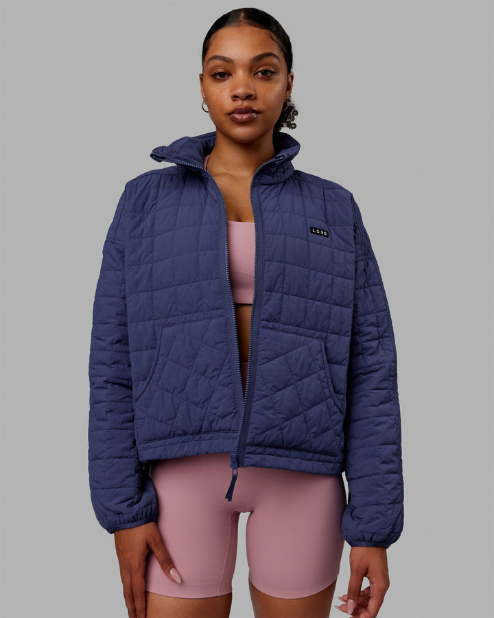 Woman wearing Thrive Packable Jacket - Future Dusk