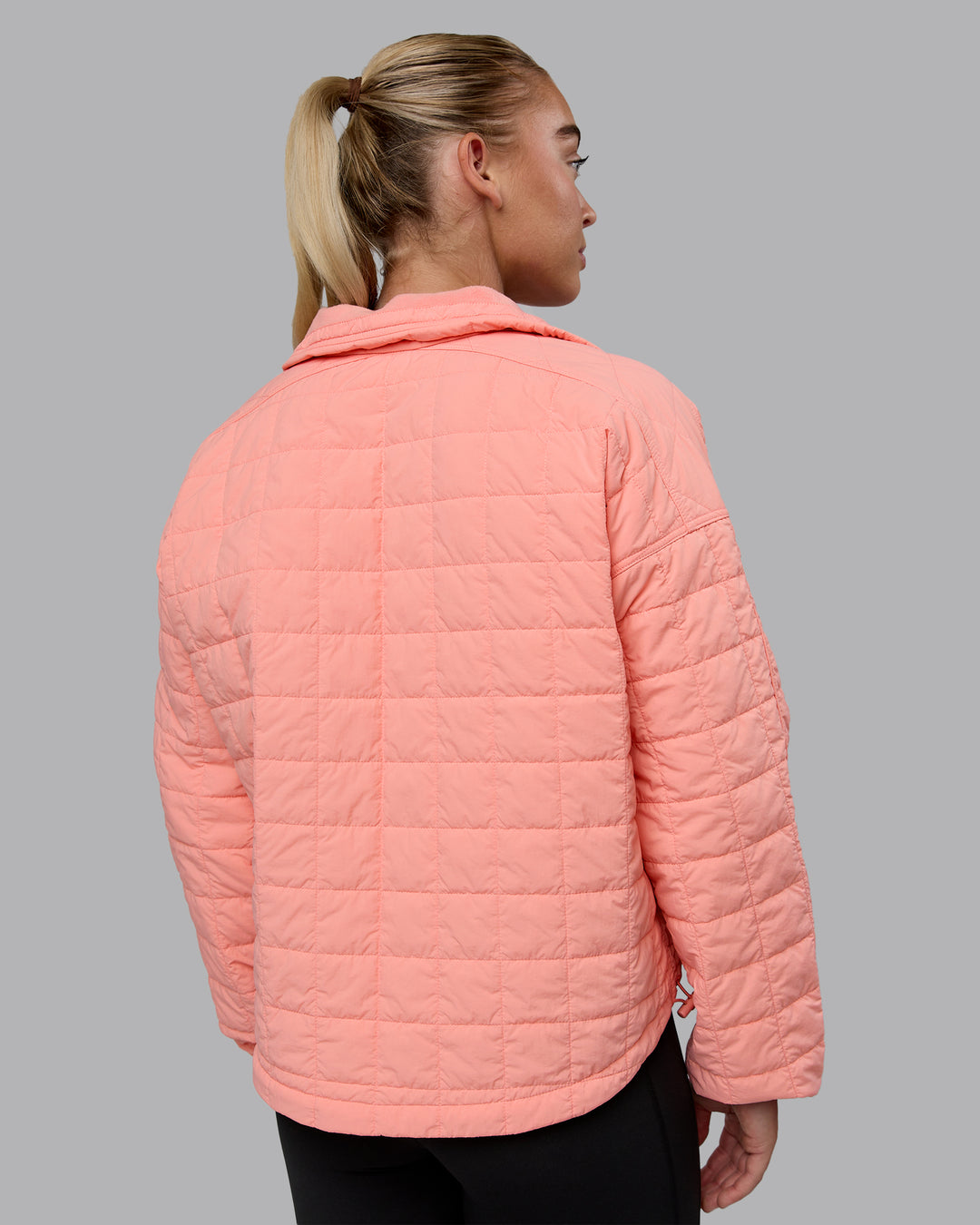 Woman wearing Thrive Packable Jacket - Murex Shell