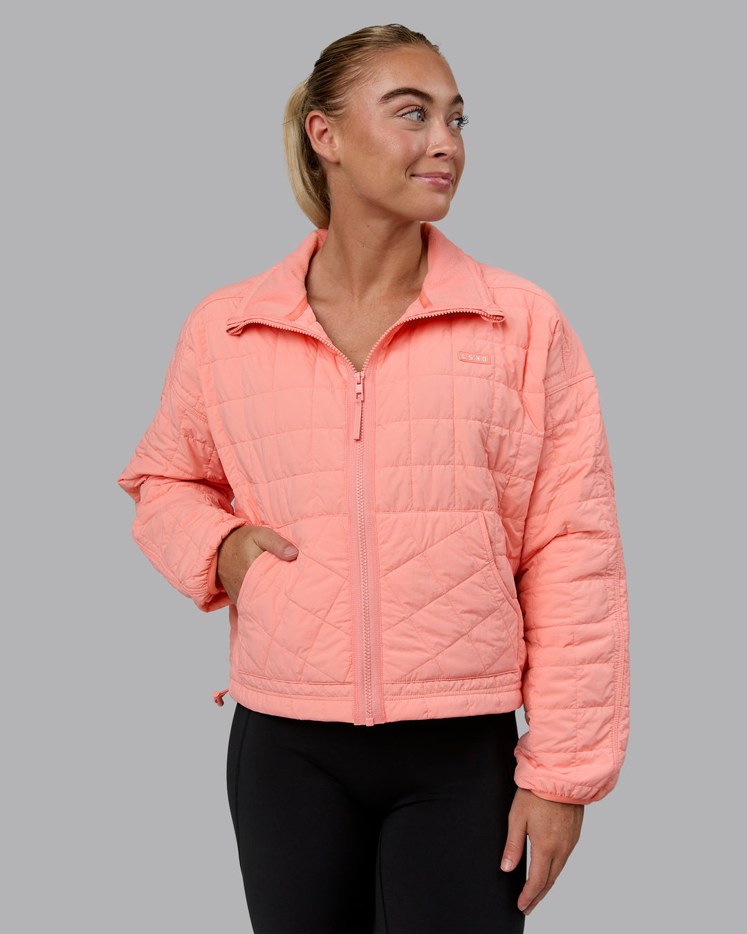 Woman wearing Thrive Packable Jacket - Murex Shell