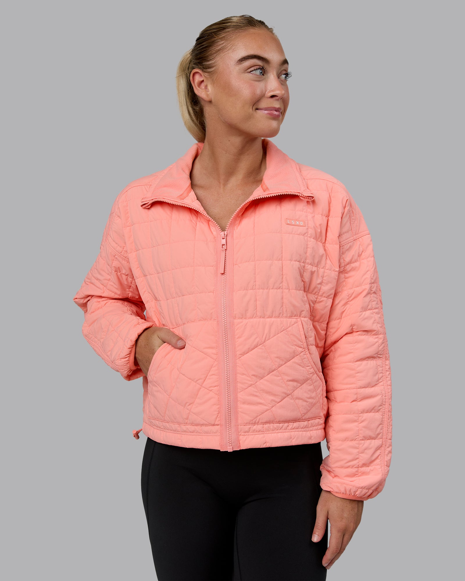 Woman wearing Thrive Packable Jacket - Murex Shell