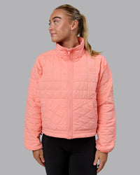Woman wearing Thrive Packable Jacket - Murex Shell
