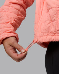 Woman wearing Thrive Packable Jacket - Murex Shell