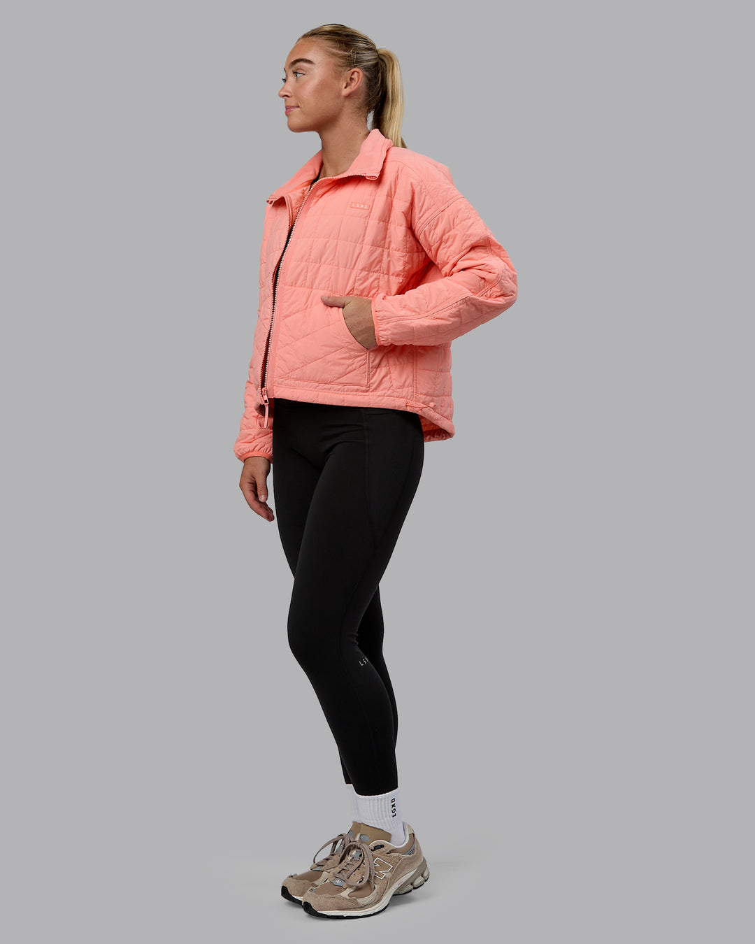 Woman wearing Thrive Packable Jacket - Murex Shell