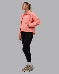 Woman wearing Thrive Packable Jacket - Murex Shell