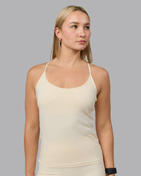 Woman wearing Transition CloudFLX Shelf Bra Tank - Ivory