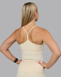 Woman wearing Transition CloudFLX Shelf Bra Tank - Ivory