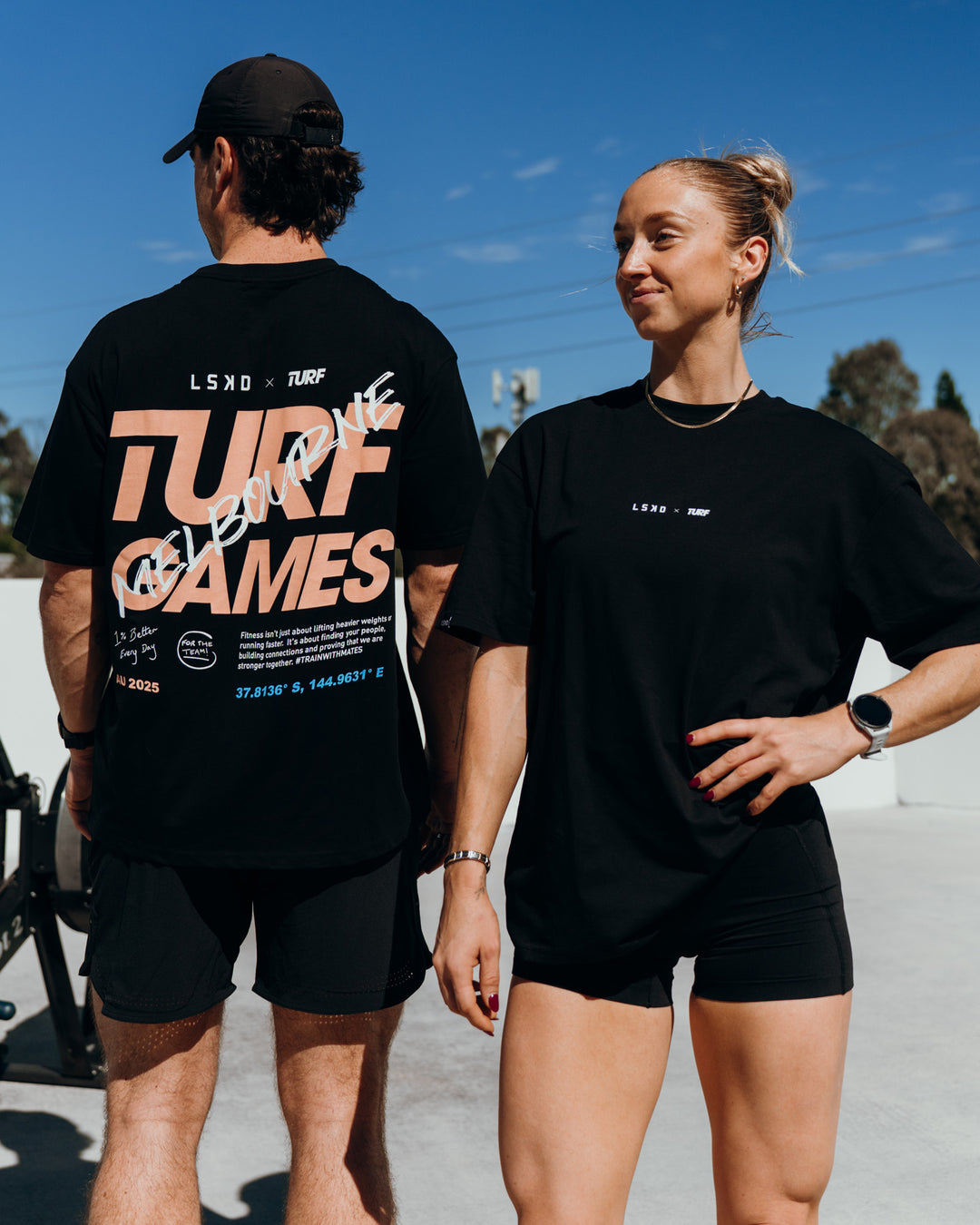 Duo wearing Turf Games Melbourne FLXCotton Oversize Tee - Black | Model:Both | Size:Duo