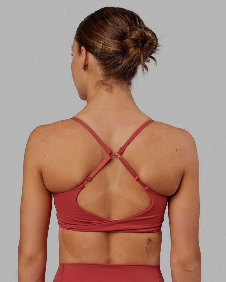 Woman wearing Twist Sports Bra - Cardinal