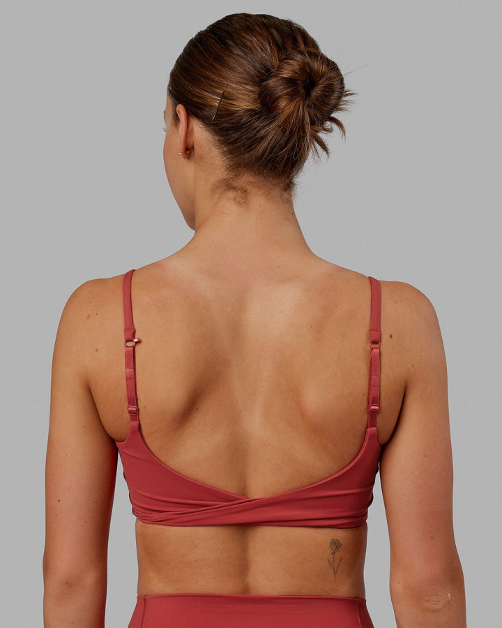 Woman wearing Twist Sports Bra - Cardinal