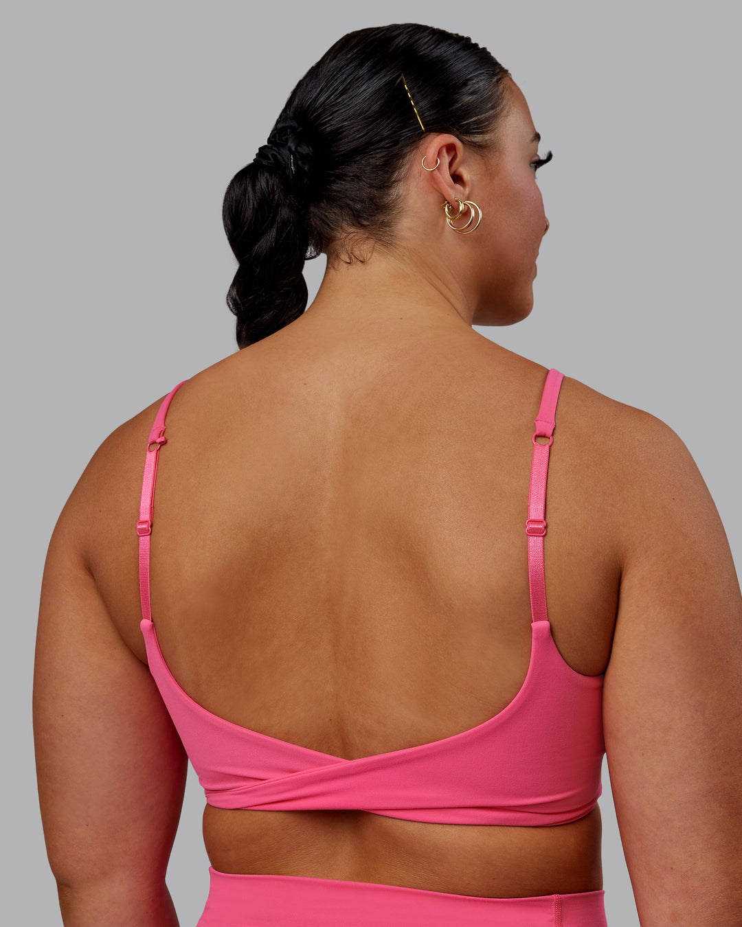 Woman wearing Twist Sports Bra - Carmine Rose