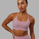 Woman wearing Twist Sports Bra - Cosmetic Pink