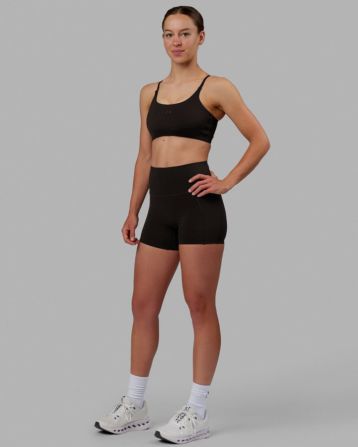 Woman wearing Twist Sports Bra - Dark Walnut