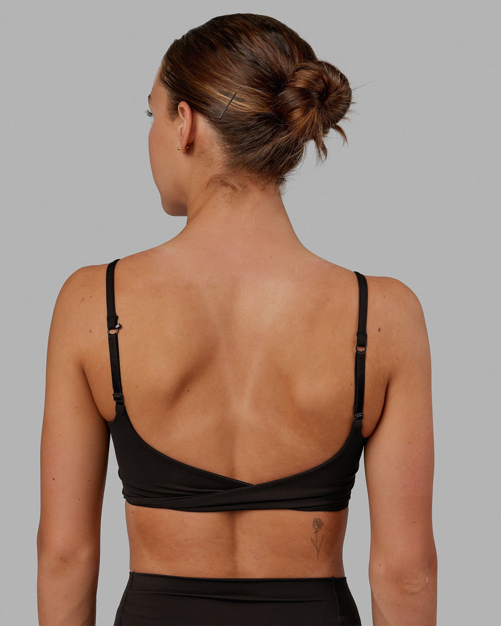Woman wearing Twist Sports Bra - Dark Walnut