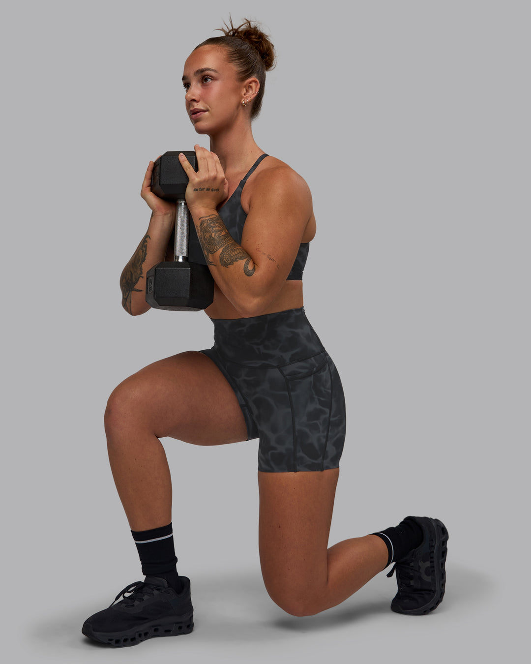 Woman wearing Twist Sports Bra - Tranquil-Black