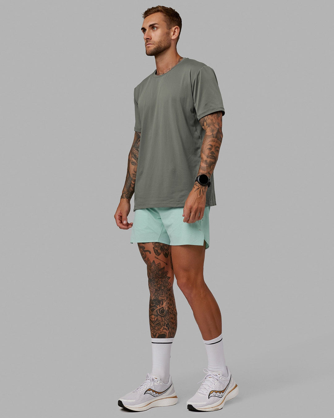 Man wearing UltraAir 5&quot; Lined Performance Short - Pastel Turquoise-Reflective