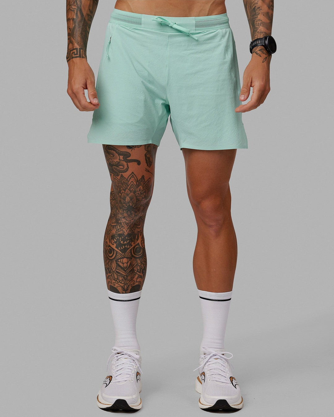 Man wearing UltraAir 5&quot; Lined Performance Short - Pastel Turquoise-Reflective
