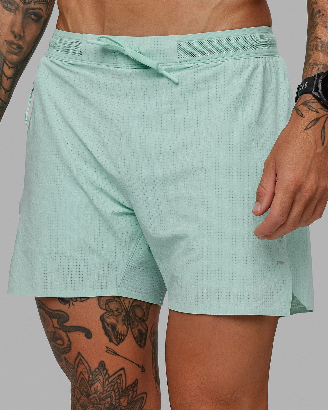 Man wearing UltraAir 5&quot; Lined Performance Short - Pastel Turquoise-Reflective