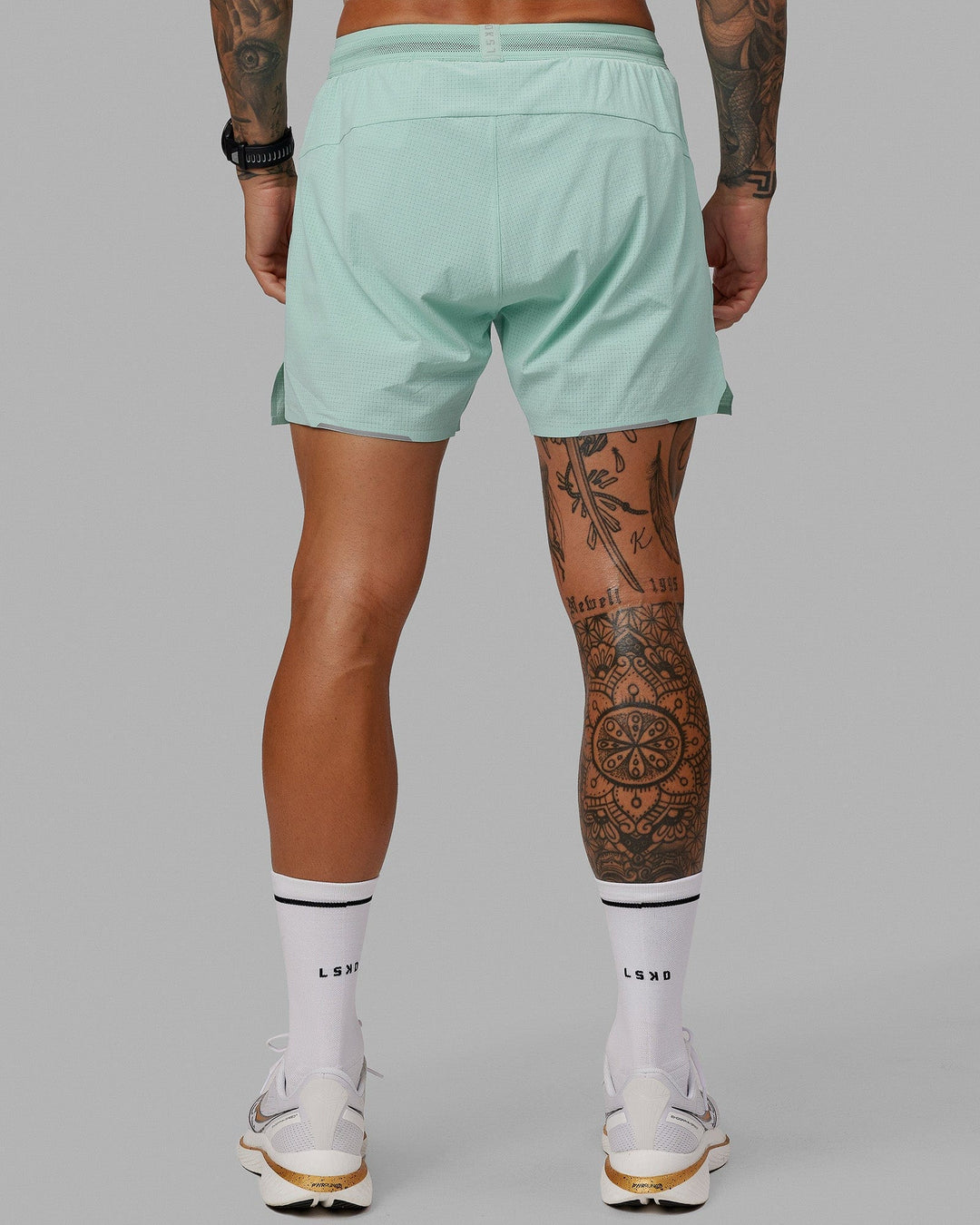 Man wearing UltraAir 5&quot; Lined Performance Short - Pastel Turquoise-Reflective
