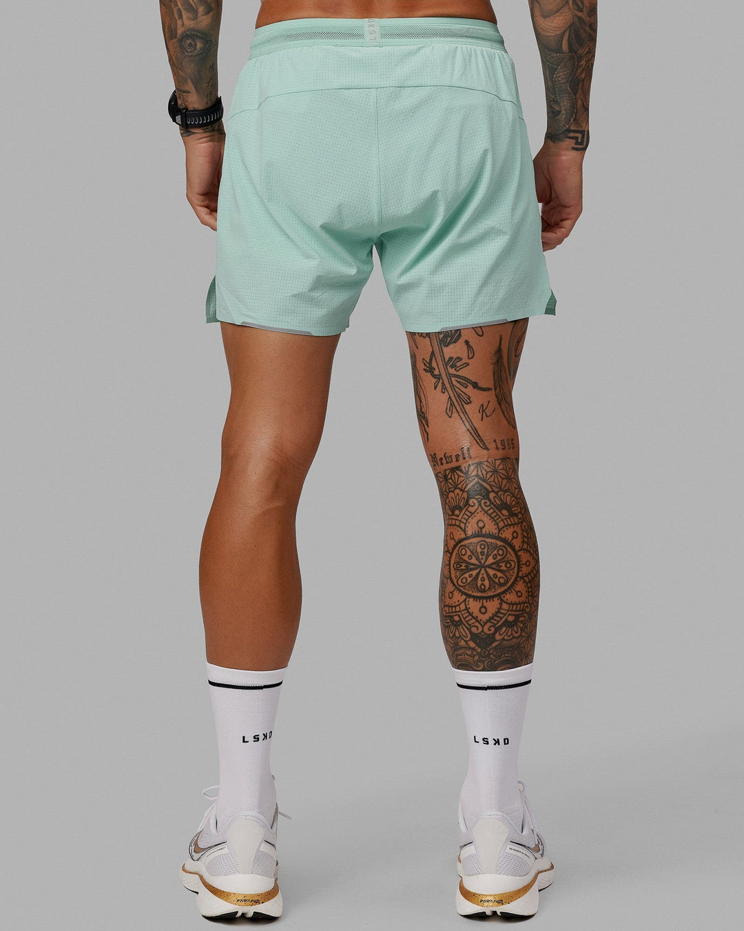 Man wearing UltraAir 5" Lined Performance Short - Pastel Turquoise-Reflective