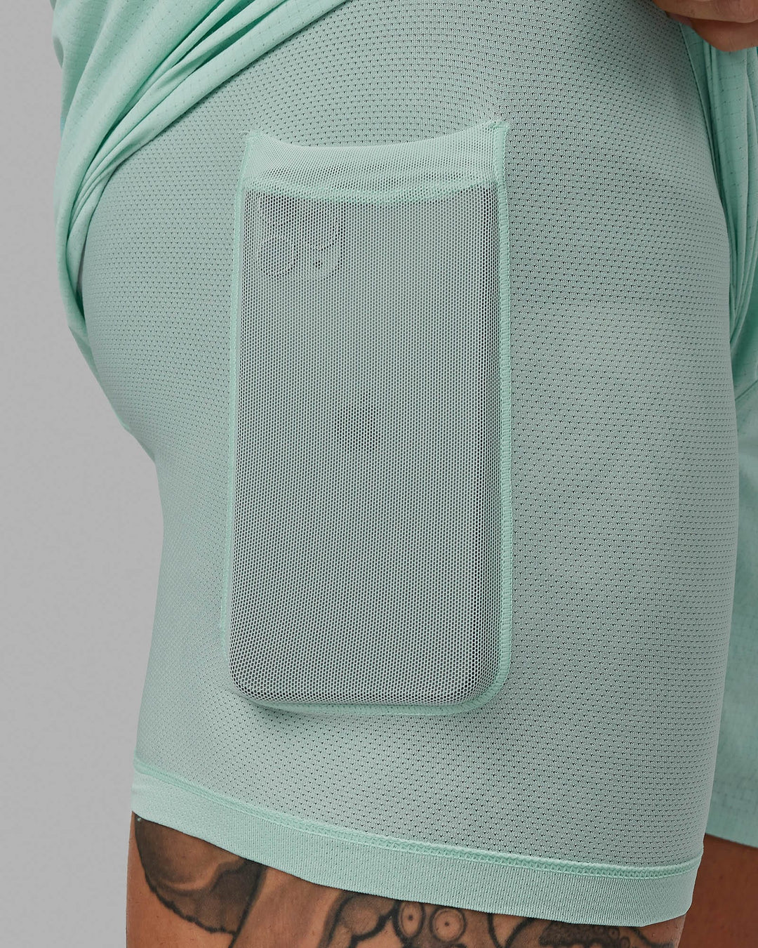Man wearing UltraAir 5&quot; Lined Performance Short - Pastel Turquoise-Reflective