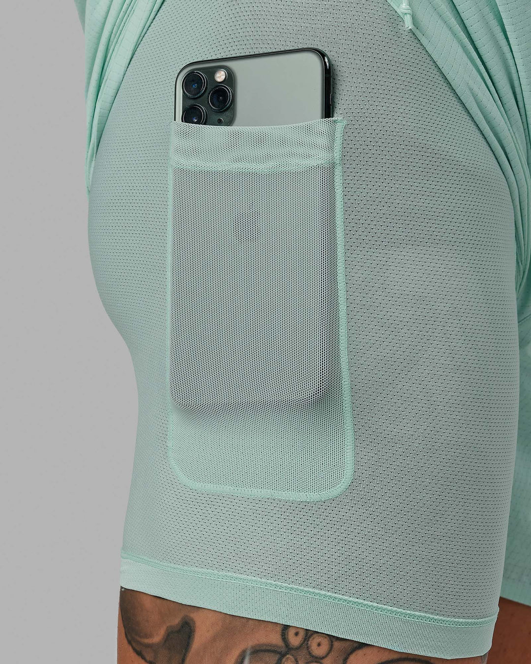 Man wearing UltraAir 5&quot; Lined Performance Short - Pastel Turquoise-Reflective