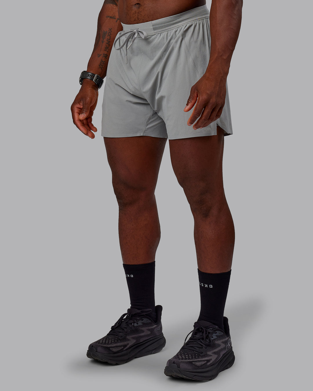 Man wearing UltraAir 5" Lined Performance Shorts - Circular Grey