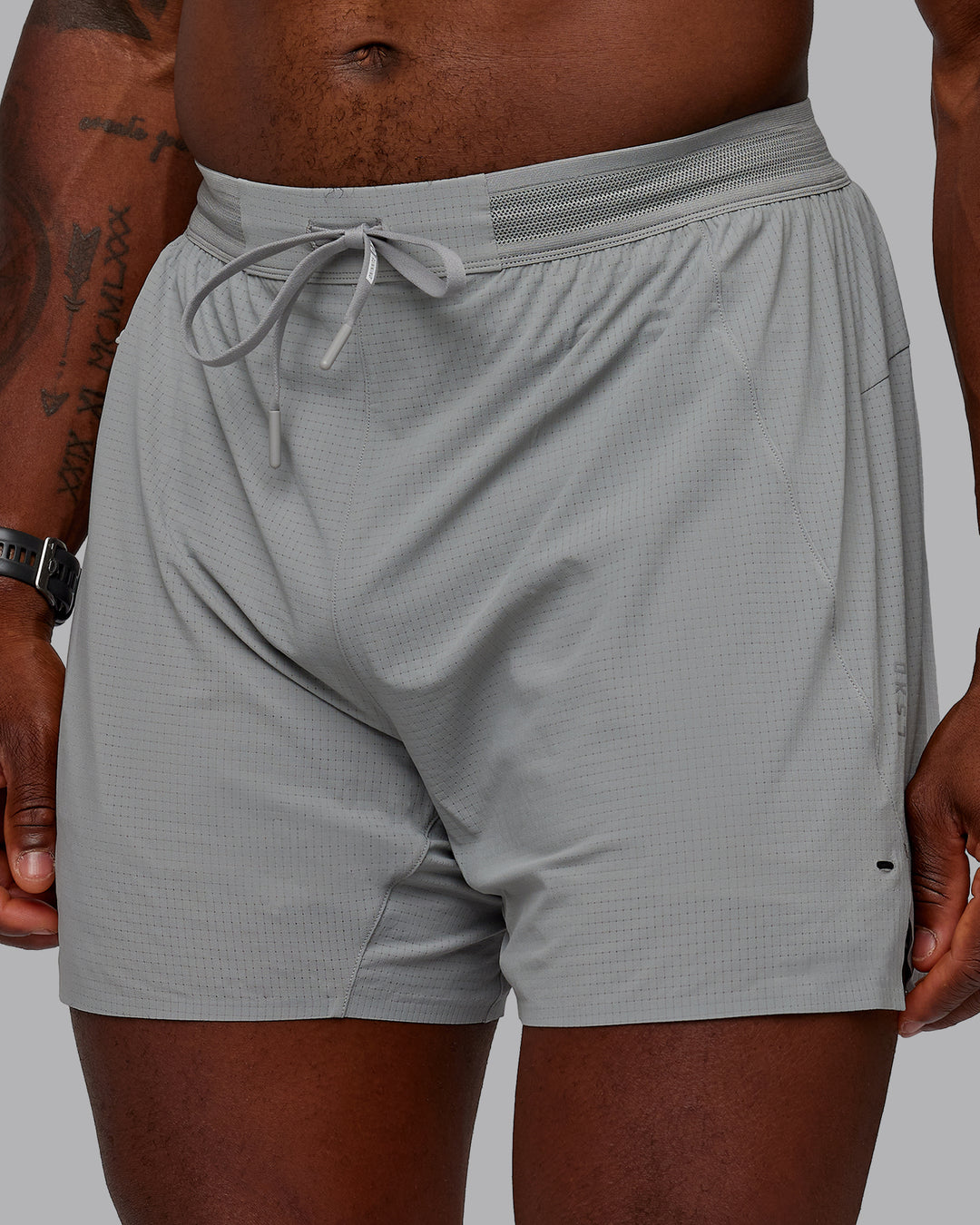 Man wearing UltraAir 5" Lined Performance Shorts - Circular Grey