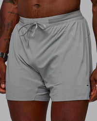 Man wearing UltraAir 5" Lined Performance Shorts - Circular Grey