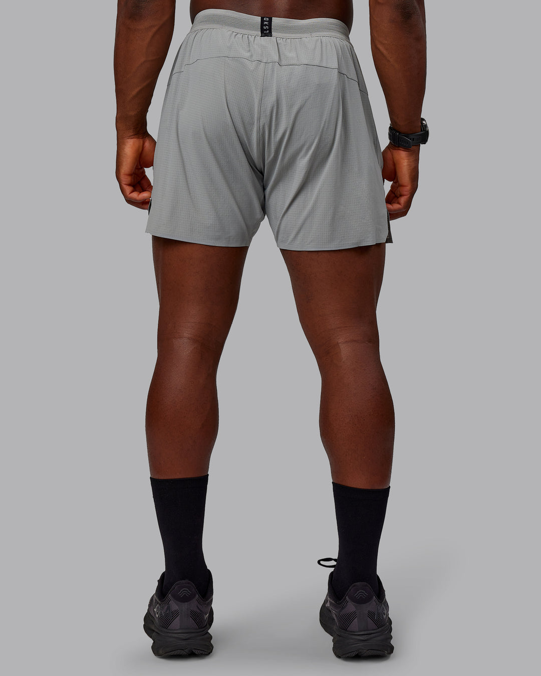 Man wearing UltraAir 5" Lined Performance Shorts - Circular Grey