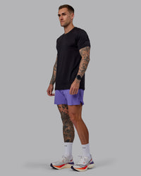 Man wearing UltraAir 5" Lined Performance Shorts - Dahlia Purple