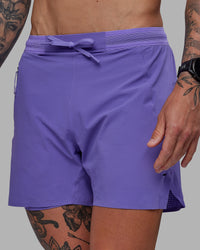 Man wearing UltraAir 5" Lined Performance Shorts - Dahlia Purple