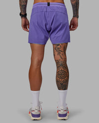 Man wearing UltraAir 5" Lined Performance Shorts - Dahlia Purple