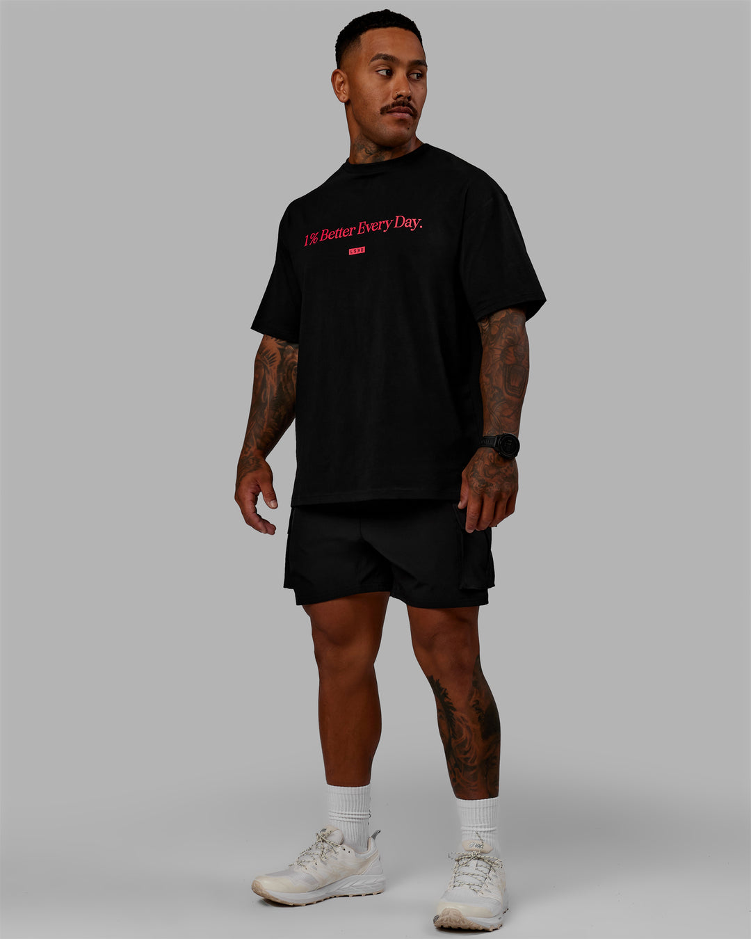 Man wearing Unisex 1% Better FLXCotton Tee Oversize - Black-Scarlet