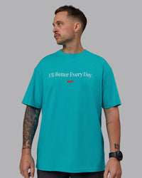 Man wearing Unisex 1% Better FLXCotton Tee Oversize - Blue Bird-White