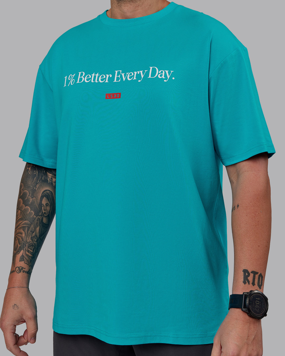 Man wearing Unisex 1% Better FLXCotton Tee Oversize - Blue Bird-White