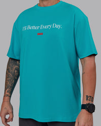 Man wearing Unisex 1% Better FLXCotton Tee Oversize - Blue Bird-White