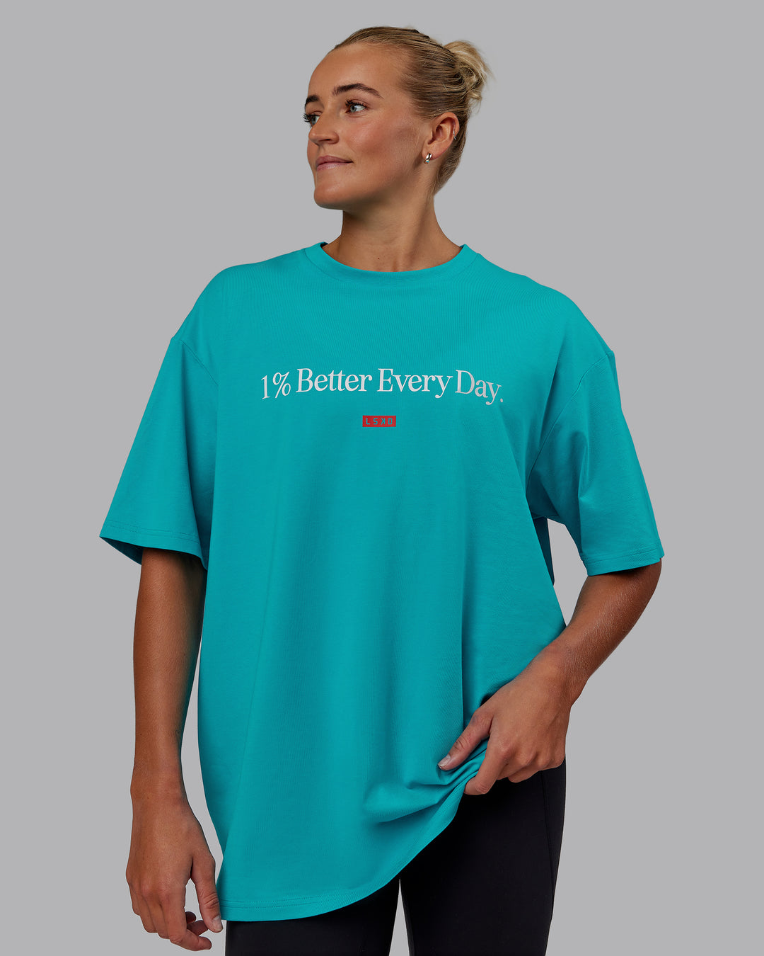 Woman wearing Unisex 1% Better FLXCotton Tee Oversize - Blue Bird-White