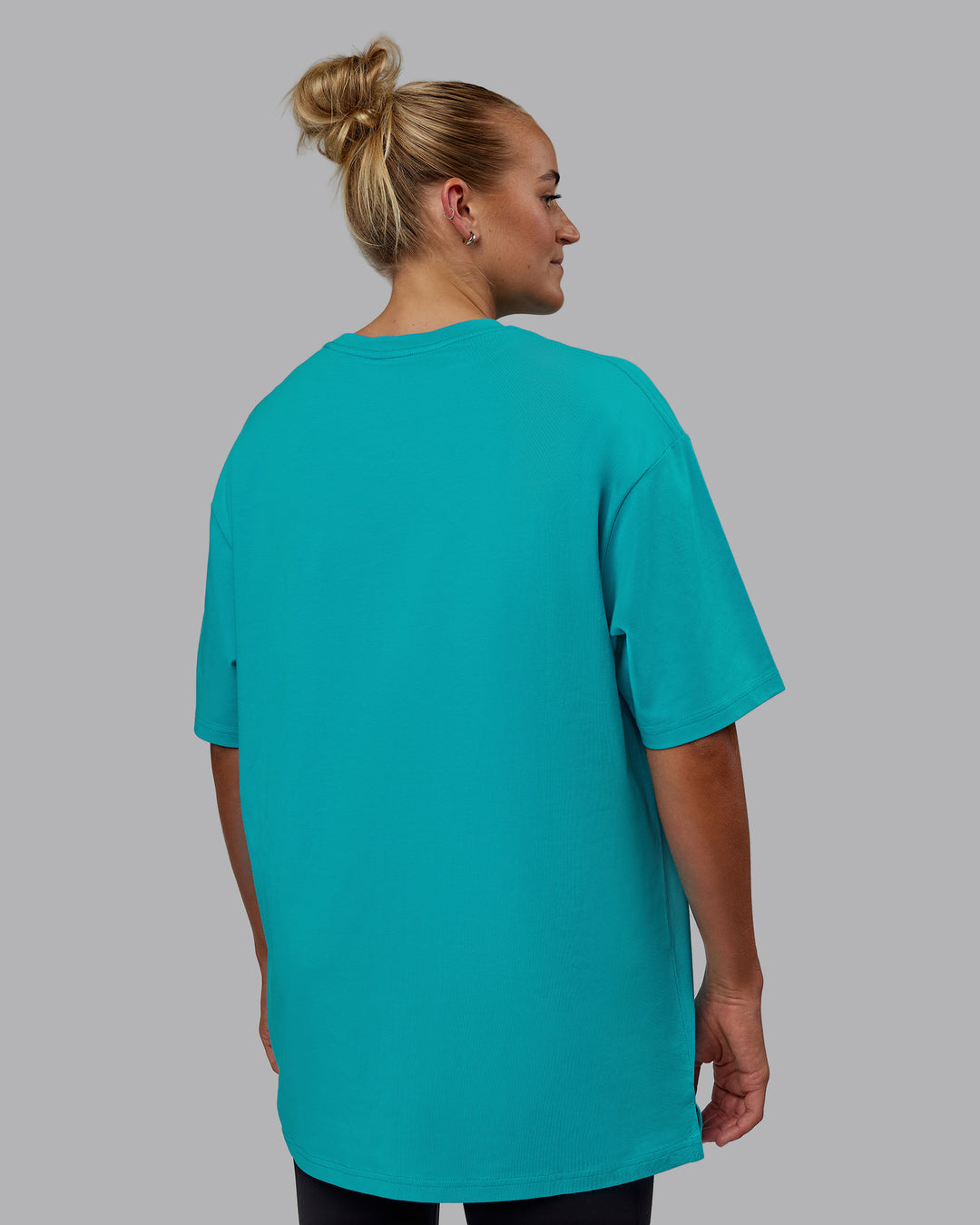 Woman wearing Unisex 1% Better FLXCotton Tee Oversize - Blue Bird-White