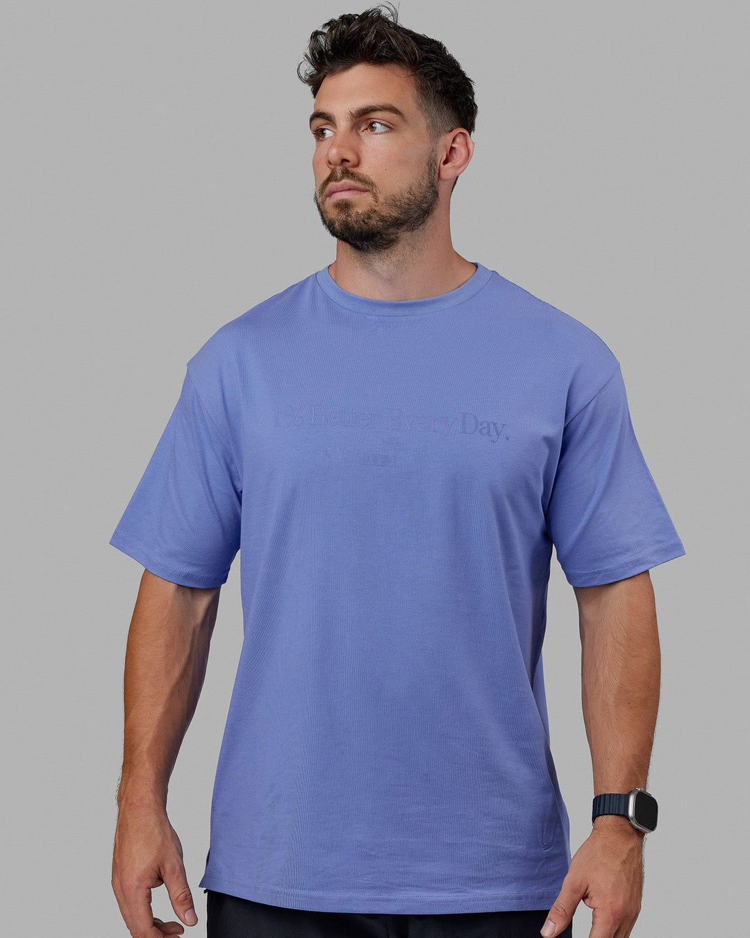 Man wearing Unisex 1% Better FLXCotton Tee Oversize - Cornflower Blue