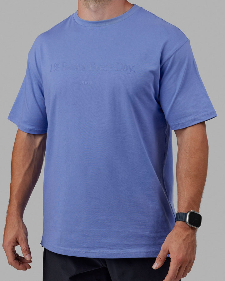 Man wearing Unisex 1% Better FLXCotton Tee Oversize - Cornflower Blue