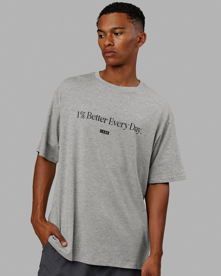 Man  wearing Unisex 1% Better FLXCotton Tee Oversize - Lt Grey Marl-Black