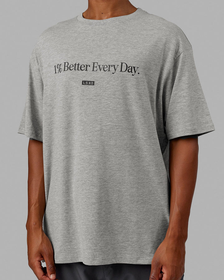 Man  wearing Unisex 1% Better FLXCotton Tee Oversize - Lt Grey Marl-Black