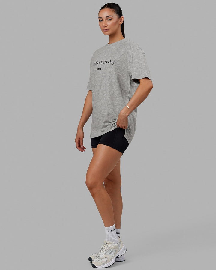 Woman  wearing Unisex 1% Better FLXCotton Tee Oversize - Lt Grey Marl-Black
